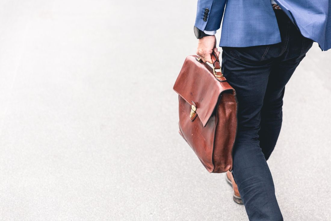 Man walking with briefcase in hand