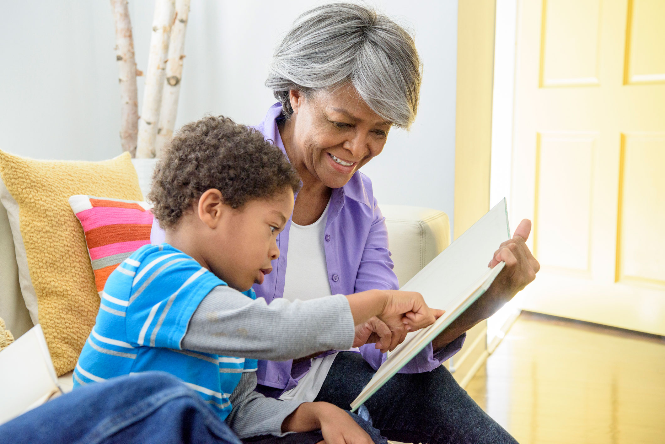 Grandmother reading her grandson