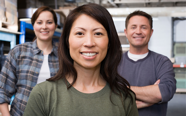 Woman with her team in the workplace