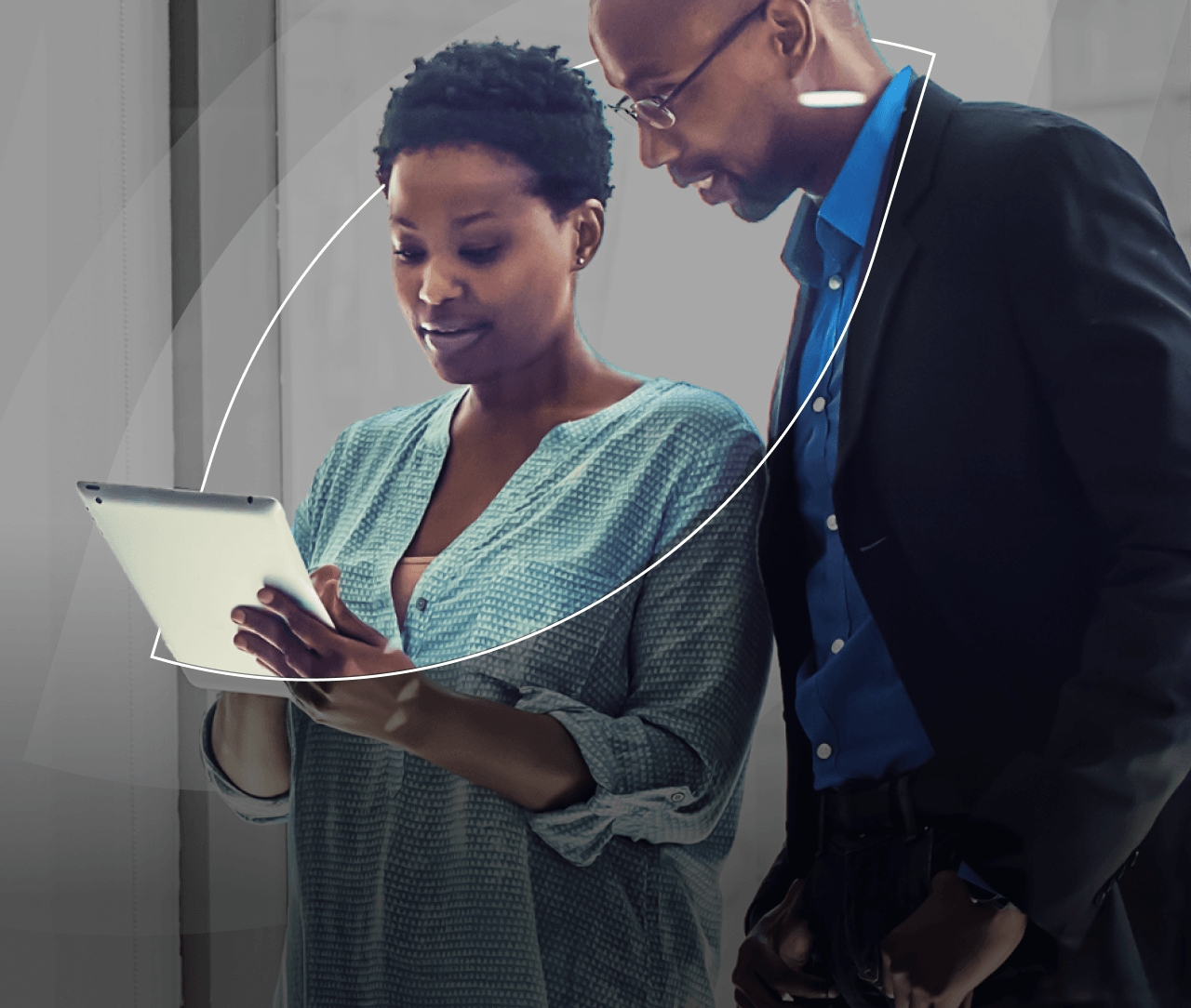Coworkers looking at a tablet.