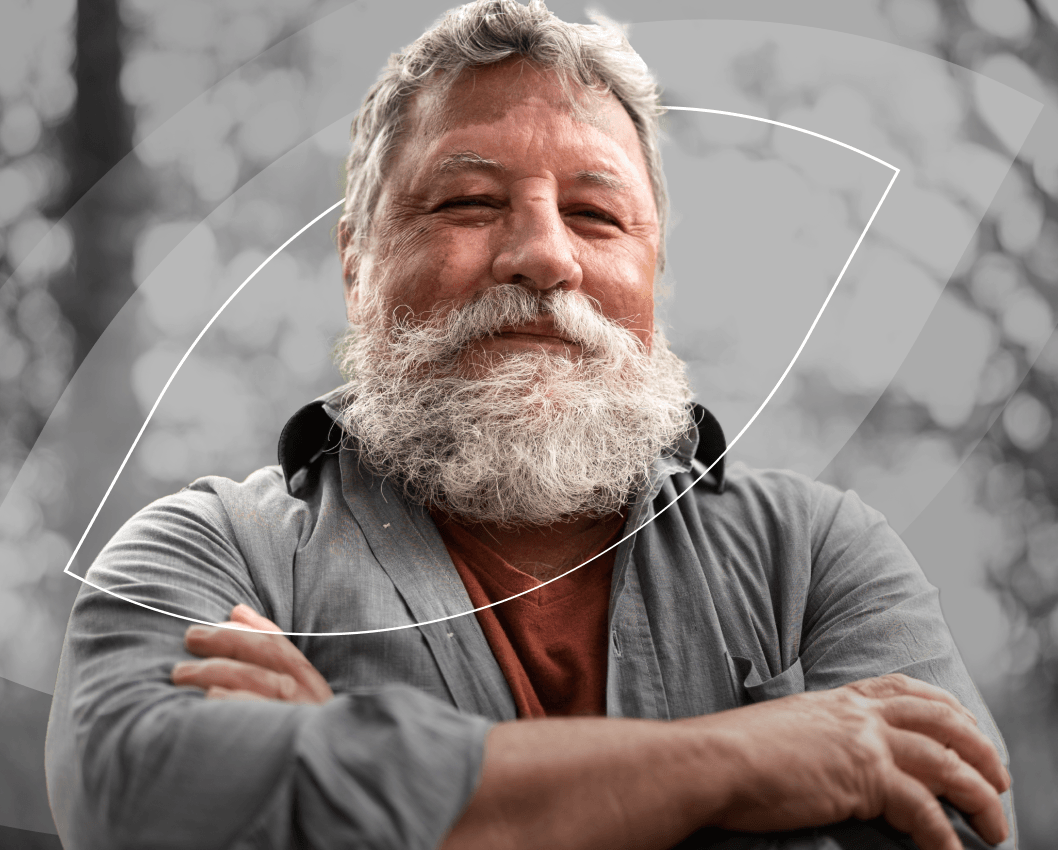 Person exuding confidence and warmth with arms crossed in a proud stance.